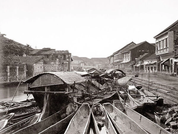 Canal scene with boats, probably Manila, Philippines