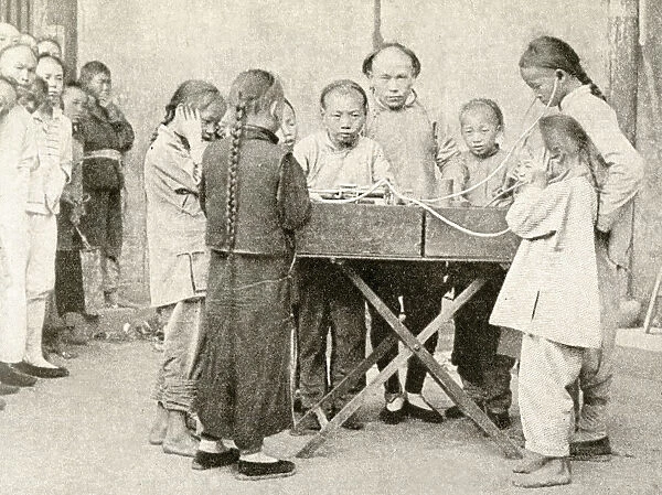 Schoolchildren listening to recording, China, East Asia