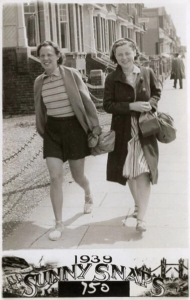 Two women walking down a London Street - Summer
