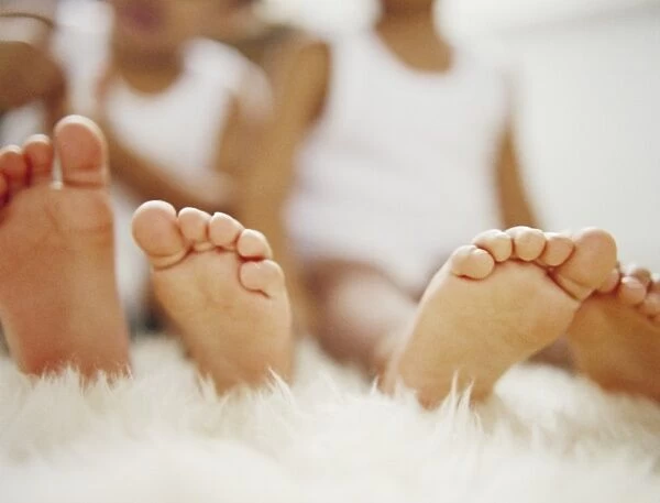 Twin feet. Feet of 2.5-year-old identical twin boys