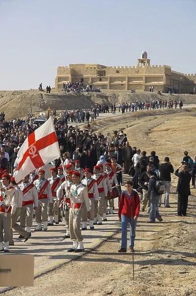 Procession to the Jordan River with scout band at the front and St