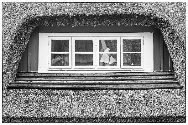 Sweden, Scania, Arild, window and thatched roof