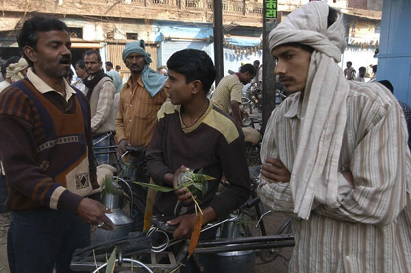 20063541. INDIA Uttar Pradesh Varanasi Milk sellers argue about prices