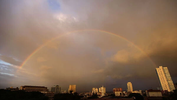 A rainbow is seen over the skyline in Havana