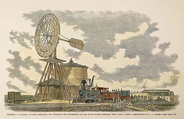 WINDMILL AT LARAMIE, 1869. Windmill at Laramie, Wyoming, for supplying the locomotives of the Union Pacific Railroad with water: colored engraving, 1869