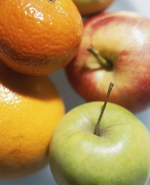 Apples, orange and tangerine, close up