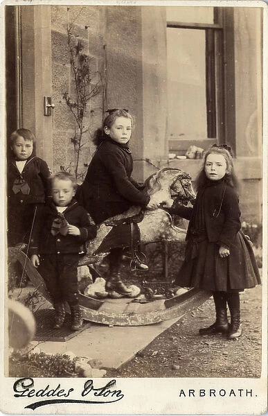 Group of young children and their rocking horse, 1880s (albumen print)
