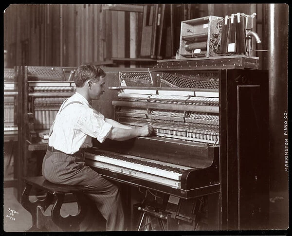 A man working in the Harrington Piano Co. factory, 1907 (silver gelatin print)