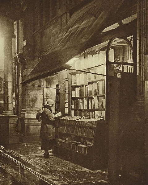 Wet winter evening and a book lover in Bloomsbury (b  /  w photo)