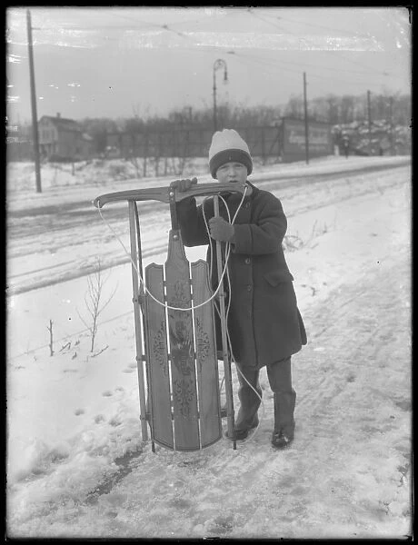 William Gray Hassler with his new sled, c. 1912 (b  /  w photo)