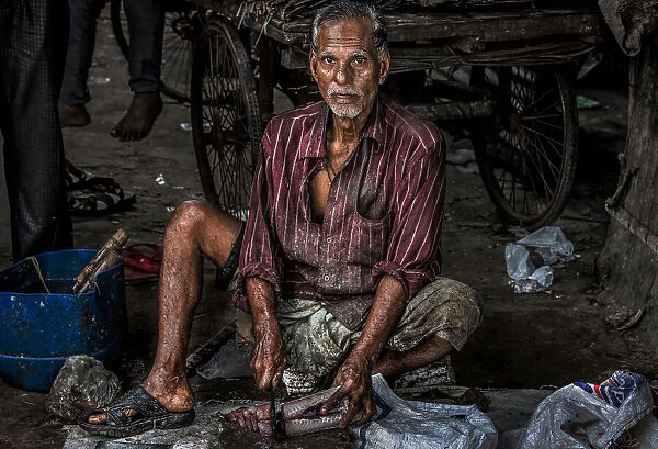 Fishmonger in the streets of Bangladesh