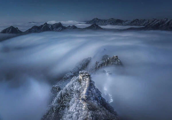 Flowing clouds pass over the Jian Kou Great Wall
