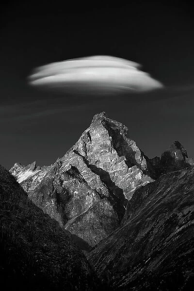 Interlude. A lenticular cloud forms over this unnamed jagged peak in the