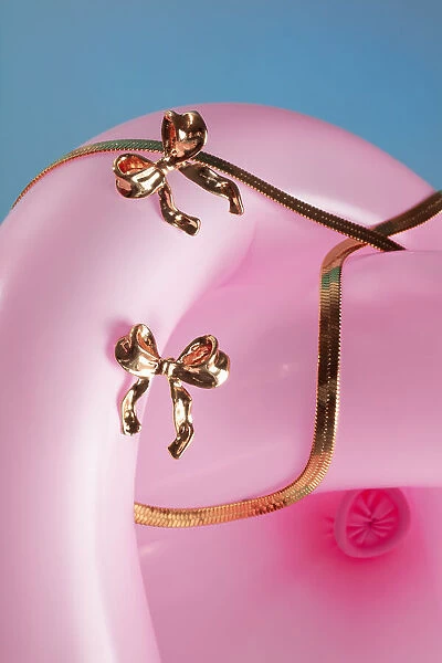 Jewelry on pink balloon