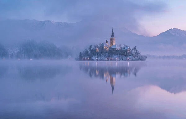 Lake Bled with the church and the castle on a calm winter morning. Ales Krivec