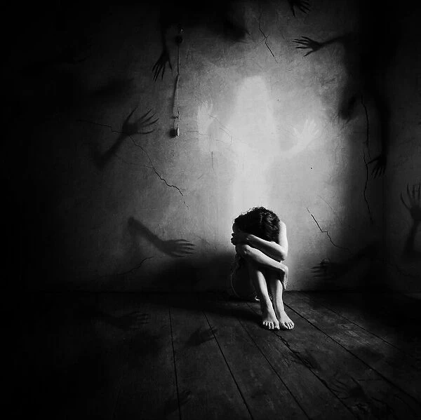 Lost Soul. sad woman sitting alone in a empty room. Sebastien DEL GROSSO