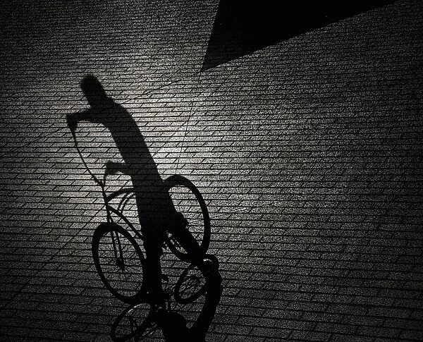 Man and bicycle shadows