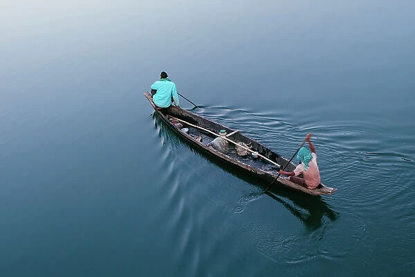 Men Rowing A Boat