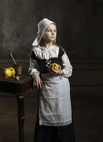 A young girl with some quinces