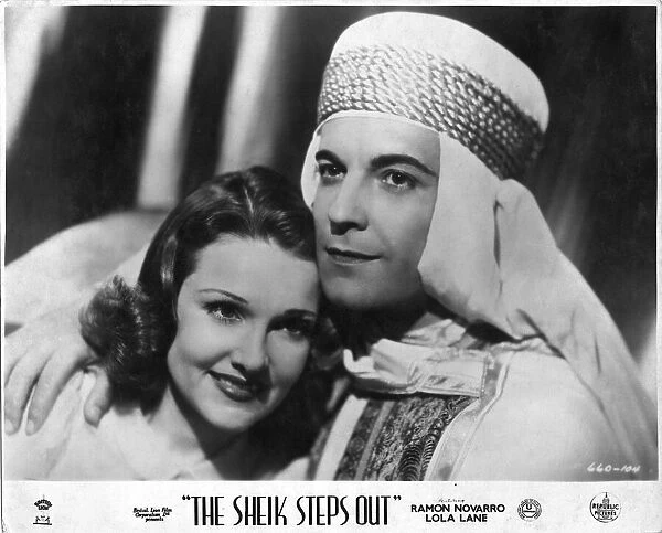Movie photograph. The Sheik Steps Out is a 1937 American musical film directed by Irving Pichel and written by Adele Buffington and Gordon Kahn. The film stars Ramon Novarro, Lola Lane, Gene Lockhart, Kathleen Burke, Stanley Fields and Billy Bevan
