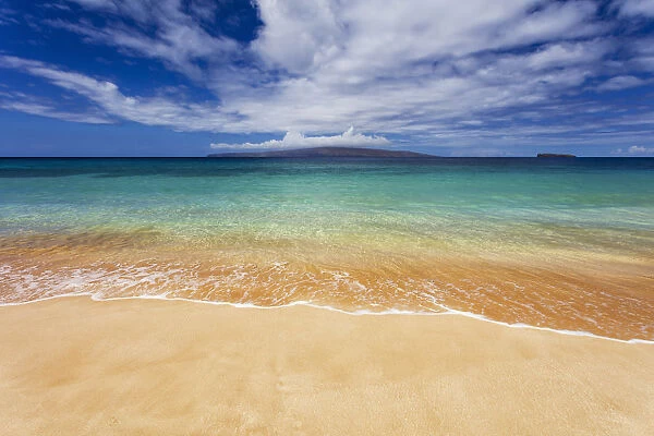 Turquoise ocean water and golden sand on Big Beach, Makena State Park, Makena, Maui