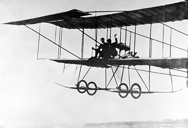 Henry Farman flying with passenger 1909. There is evidence to suggest that he was