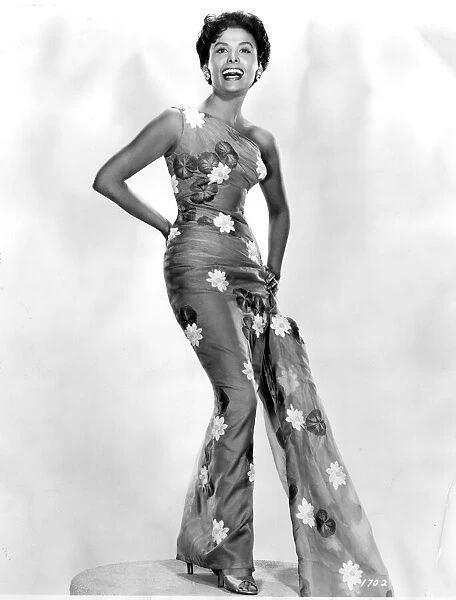 Singer Lena Horne 1956 wearing one piece catsuit with flower detail and flared leg