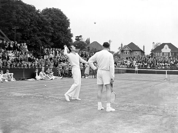 Tennis Fred Perry and Dan Maskell coach children from the Surbiton High School