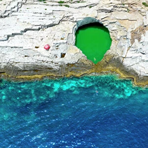 Aerial view of tourists bathing in the Giola, a natural pool on Thassos island, Greek Islands, Greece, Europe