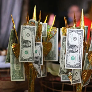 US dollars on Buddhist money tree to make merit and donate to local temple