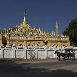 Horse and cart passing the Thanboddhay Paya, built between 1939 and 1952 by Moehnyin Sayadaw