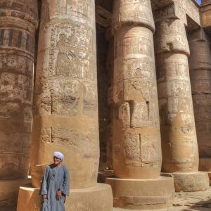 Local man, Columns in the Great Hypostyle Hall, Karnak Temple, Luxor, Thebes, UNESCO