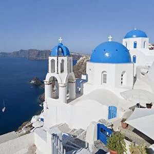 Blue domed churches in the village of Oia (La), Santorini (Thira), Cyclades Islands