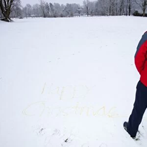 Happy Christmas written in the snow by a man weeing