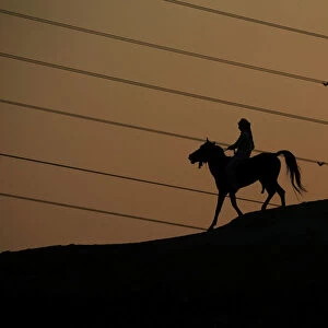 A man rides a horse in the holy Shi ite city of Najaf