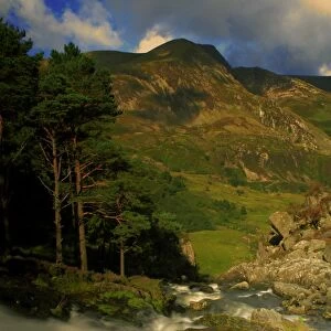 View of waterfall in valley with mountain in background, Ogwen Falls, Afon Ogwen, Mynydd Perfedd, Snowdonia, Wales