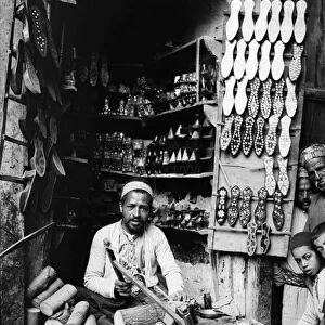 DAMASCUS: SLIPPER MAKER. An inlaid slipper maker in his shop in Damascus, Syria