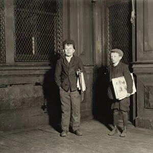 HINE: NEWSBOYS, 1912. Two illiterate newsboys working on a Saturday night until 3 A