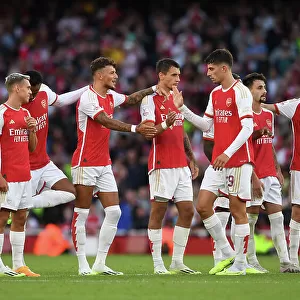 Arsenal's Ben White Greets Kai Havertz: Emirates Cup Clash vs AS Monaco (2023-24)