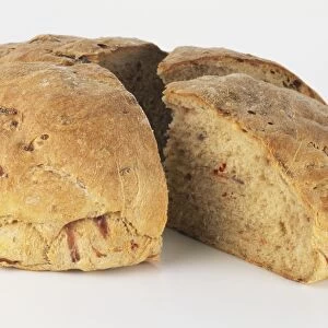 Loaf, with two quarter slices removed, of Pane con Pomodori E Cipolle Rosse, tomato and red onion bread
