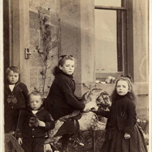 Group of young children and their rocking horse, 1880s (albumen print)