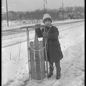 William Gray Hassler with his new sled, c. 1912 (b / w photo)