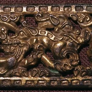 Chinese bronze belt-buckle with animals in combat, 5th century BC