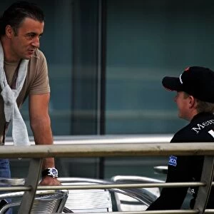 Formula One World Championship: Jean Alesi talks with Kimi Raikkonen McLaren