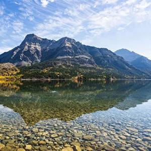 Clear lake and rugged mountains in Waterton Lakes National Park, Alberta, Canada