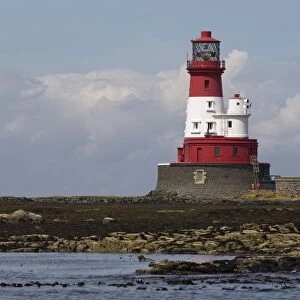 A Lighthouse On A Shoreline
