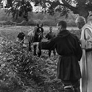 Benedictine monks work hard to help food production. October 1943 P011617