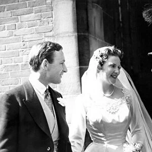 A chimney sweep wishing the bride good luck at her wedding. circa 1960