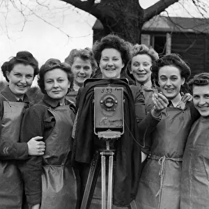 "The snappers snapped. "Ground-camera girls smiling happily on the first